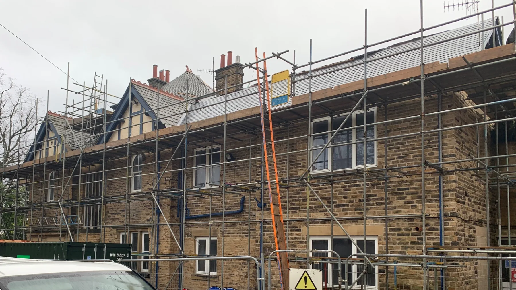 Property development under construction showing scaffolding and ongoing building works